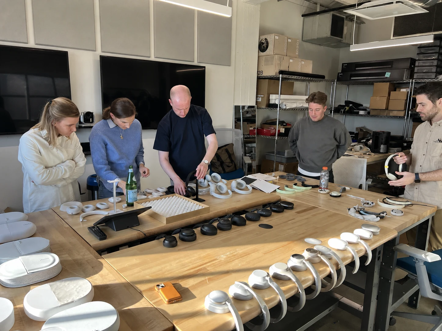Sonos team evaluating headphone prototypes in a hardware workshop