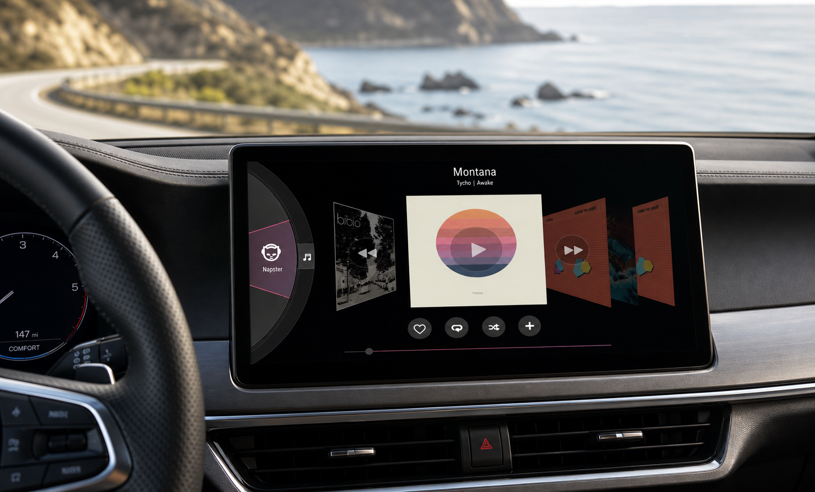 OpenCar music interface displayed on an in-car dashboard along a coastal road